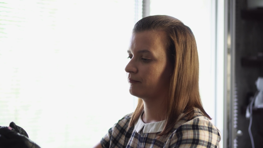 Artisan soften polymer clay in workshop. Woman craftsman at work. Handmade and hobby concept.