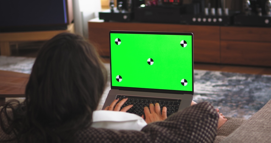 Green mockup screen, chroma key of laptop. Business woman working on computer with tracking markers. Typing girl | Shutterstock HD Video #1069493737
