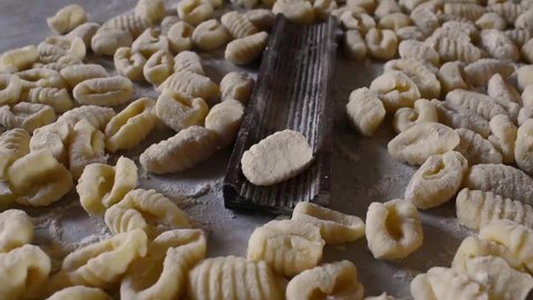 Gnocchi with potatoes. On a table ready to cook. Traditional italian food from Rome, Sardinia, south of italy. 