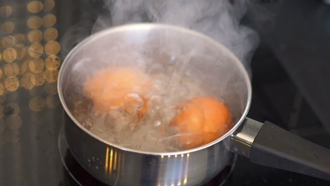 Eggs boiling in the pot in slow motion