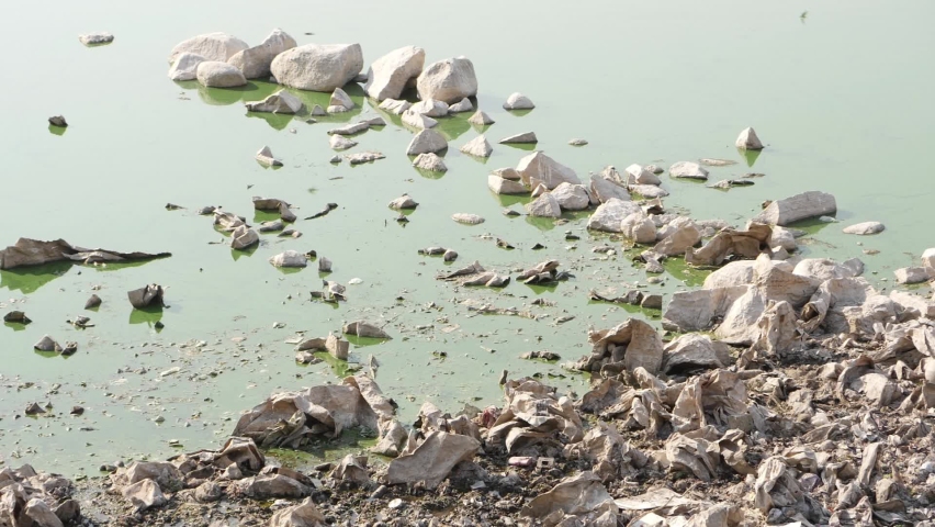 View of stones at the shore of lake, Large stones in the lake