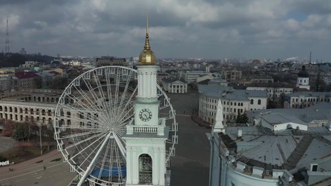Ferris wheel at Kyiv Kontraktova square aerial view. Podil aerial landscape. Historical district of Andriivskyi street