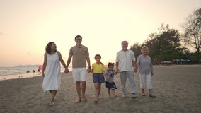 Happy big Asian family on summer beach travel vacation. Multi-generation family enjoy and fun outdoor lifestyle holding hands and walking together on the beach at summer sunset on beach holiday trip - Powered by Shutterstock - Get 15% off with code: PIKWIZARD15