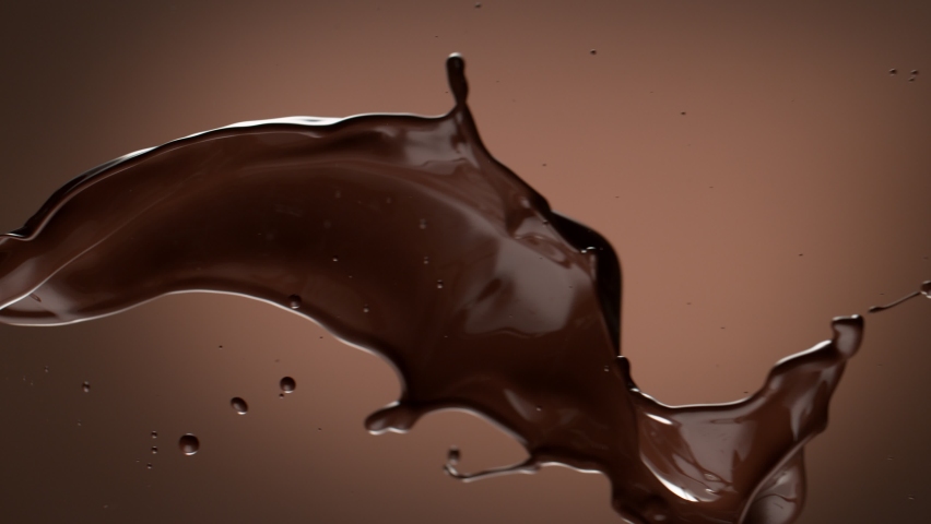 Super slow motion of dark hot chocolate splashing. Filmed on high speed cinema camera, 1000fps. Royalty-Free Stock Footage #1069528933