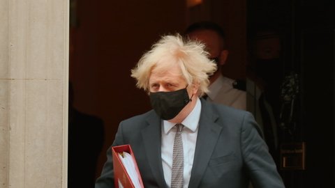 LONDON, 24 MAR 2021 - Boris Johnson leaves 10 Downing Street for PMQs at the Parliament, a day after he's reportedly told the success of the UK vaccine program was down to "capitalism" and "greed".