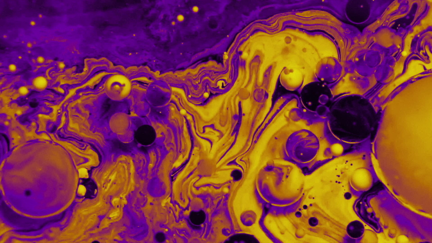 Abstract colorful fluid art painting background. Pouring technique. Liquid marble. Alcohol inkscape. Macro top view. Violet and yellow color palette. Royalty-Free Stock Footage #1069534321