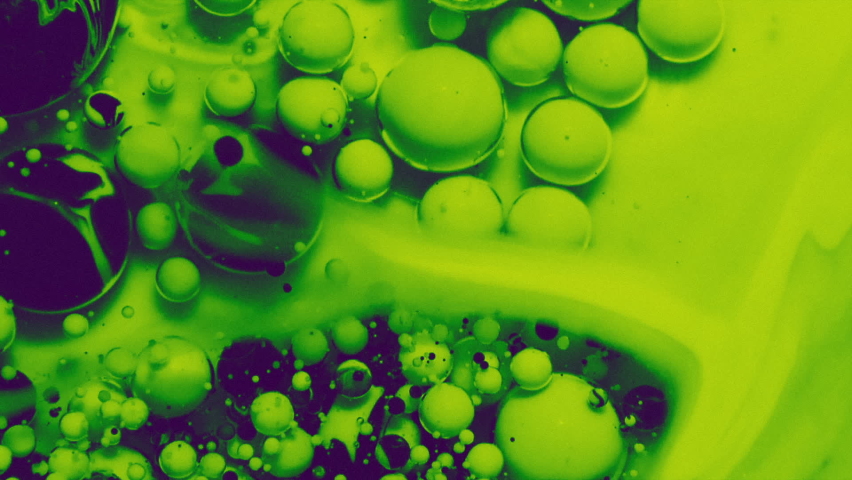 Abstract colorful fluid art painting background. Pouring technique. Liquid marble. Alcohol inkscape. Macro top view. Green and black color palette. Royalty-Free Stock Footage #1069535923