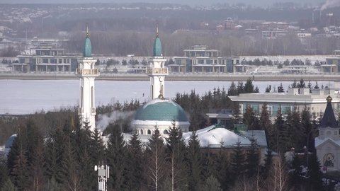 irek mosque Kazan Tatarstan. Smoke from pipe. Frozen river at winter background. High quality 4k footage