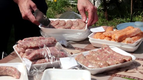 Kebabs. B-B-Q. Man fries bbq outdoors, preparing for a picnic