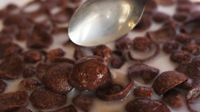 eating chocolate cereals with spoon, morning breakfast close-up Royalty-Free Stock Footage #1069556950