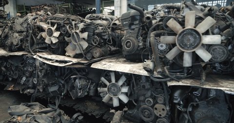 Used auto parts pile of old car at garage, Mechanical parts, heap of auto parts, old rusty iron chains.