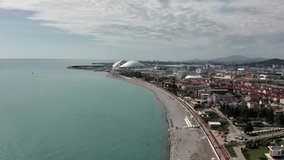 Aerial video shooting from a drone. View of the Sochi Olympic Park. Fisht. City beach where people relax. Resort