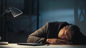 Overwork fatigue. Night insomnia. Project deadline. Procrastination crisis. Tired bored sleepy business man stopped working yawning closing laptop taking nap at dark home office workplace. - Powered by Shutterstock - Get 15% off with code: PIKWIZARD15