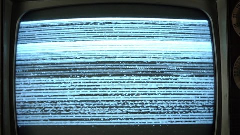 Video static and glitches on a vintage TV set