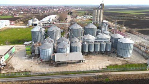 Silos complex outdoors. Steel storage for agricultural harvest. Grain tank. Silos landmark. Aerial top view. Seasonal storage. Corn sotrage.