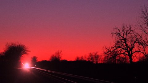 Winnipeg Canada Mar 1 2021 Via Rail moves through prairies with sunset background
