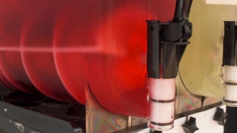 Ice strawberry fruit juice crush machine rotating inside, closeup detail
