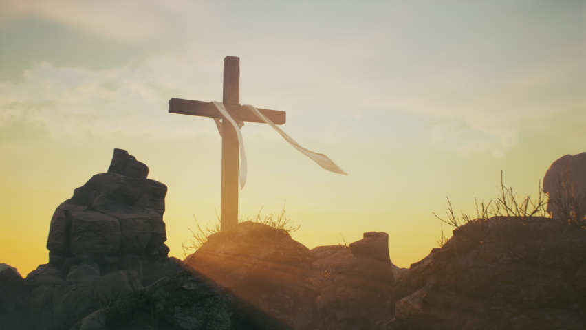 Zoom out view of wooden cross with fluttering cloth placed on rocks against blue sky on day of Jesus Christ resurrection on Golgotha in Jerusalem Easter | Shutterstock HD Video #1069610743