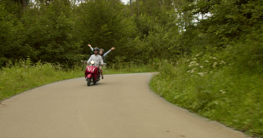 the girl put out her hands and enjoys the cool air that envelops her face