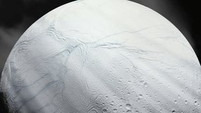 Surface of the Icy Moon Enceladus, Moon of Saturn, and Sun Rays. Elements of this Video furnished by NASA. 4K Resolution. 