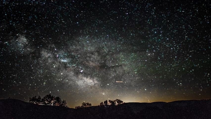 Milky way on the dark night sky. Night sky milky way galaxy. This animated video can loop able to any duration as you want. Starry night, blue night sky infinity stars, and starry sky. | Shutterstock HD Video #1069621885