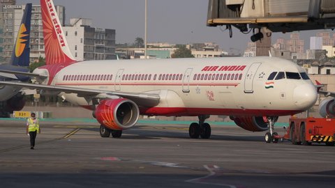 Mumbai, Maharashtra, India - February 26, 2021: Air India Airbus 321 getting pushed back for scheduled departure
