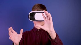 Child in virtual reality helmet gestures controls. - Powered by Shutterstock - Get 15% off with code: PIKWIZARD15