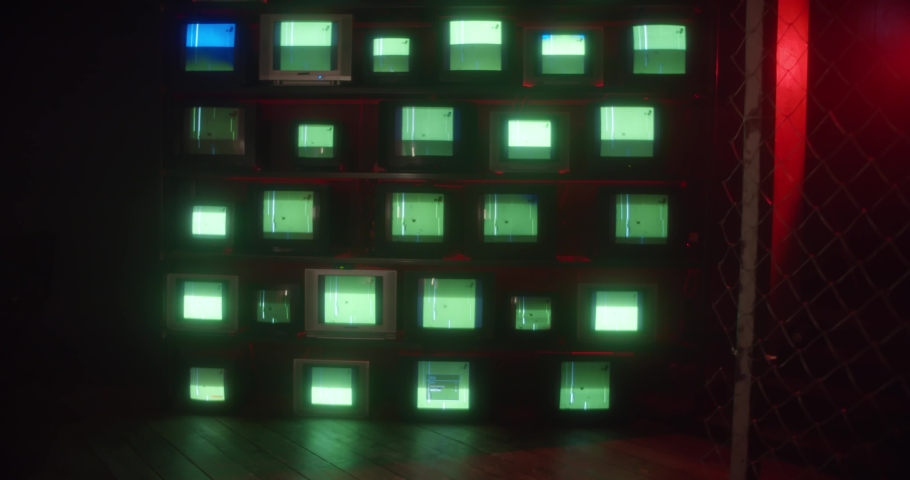 Old TV sets with static turned on Green screens. Lots of chromakey TVs in a dark room | Shutterstock HD Video #1069627909