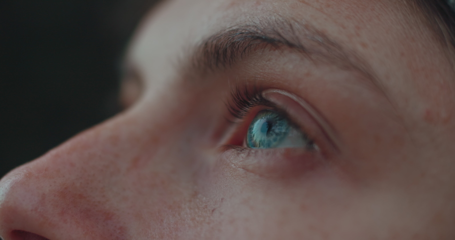 Close up of female eye. Authentic candid real woman outside in nature or on street, look up at sky with clear blue eyes. Beautiful mindfulness concept. Human feelings and emotions Royalty-Free Stock Footage #1069634791