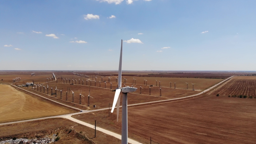 Small wind turbines with blades in the field aerial view. An old type of wind generator. alternative energy | Shutterstock HD Video #1069646962