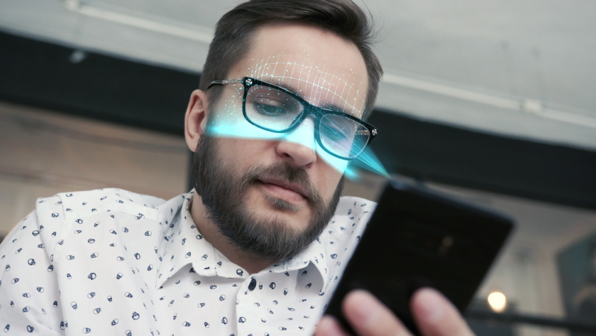 Smart Phone Technology Using Facial Recognition Biometrics Iris. Person Use Face Id on Hand Device. Young Handsome Man and Hi-tech 3d Detection Portrait. Futuristic Scanned Cyber Security People Id 4k | Shutterstock HD Video #1069648672