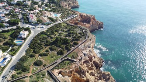 Wooden broadway by cliffs by the Atlantic Ocean near Carvoeiro, Algarve, Portugal