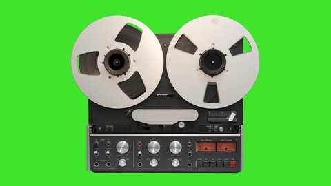 4K: Reel to Reel Tape Recorder in front of Green Screen Chroma Key - Vintage retro Audio Machine. Front view. Stock Video Clip Footage