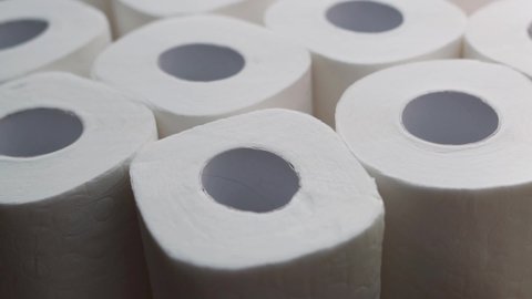 White Soft Multi-Layer Toilet Paper in Rolls, Macro. Sanitary accessories for the Toilet. Insulated Background made of Rolls of Quality Toilet Paper.