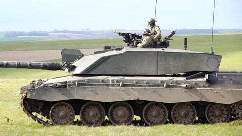 close up action shot of a British Army Challenger 2 FV4034 Main Battle Tank on a military exercise, Salisbury Plain, Wiltshire UK