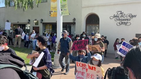 Demonstrators take part in a rally and march to denounce anti-Asian sentiment, racism and hate crimes that have been exacerbated by the COVID-19 pandemic, on March 26, 2021, in Alhambra, California.
