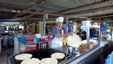 Seremban, Malaysia  - 27th March 2021 : Unidentified man making roti canai, a favourite local food in Malaysia especially for breakfast