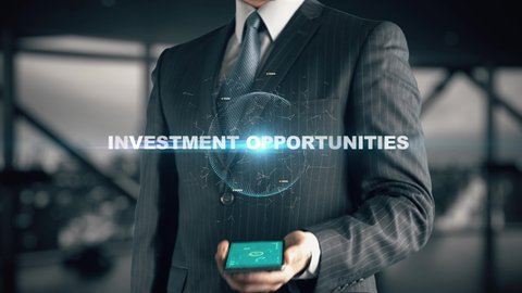 Businessman with Investment Opportunities hologram concept