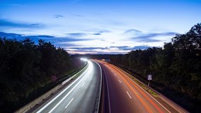 Timelapse of Cars at a big Road Autobahn Runway in Germany at nightfall late Evening Sunset Blue Hour Car - Powered by Shutterstock - Get 15% off with code: PIKWIZARD15