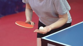 Close up of a female table tennis or ping pong player serving, slow motion - Powered by Shutterstock - Get 15% off with code: PIKWIZARD15