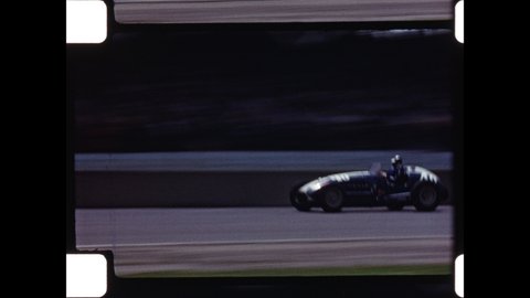 1950s Indianapolis, IN. Race Cars Speed around the track at Indianapolis Motor Speedway during Indianapolis 500. The Amateur Home Movies Capture the Event. 4K Overscan of Vintage Archival 16mm Film 