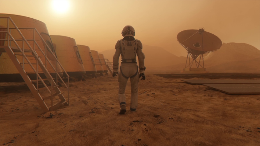 Astronaut on the planet Mars, making a detour around his base. Astronaut walking along the base. Small dust storm. The satellite dish sends data to the ground. Realistic 3D animation | Shutterstock HD Video #1069697989