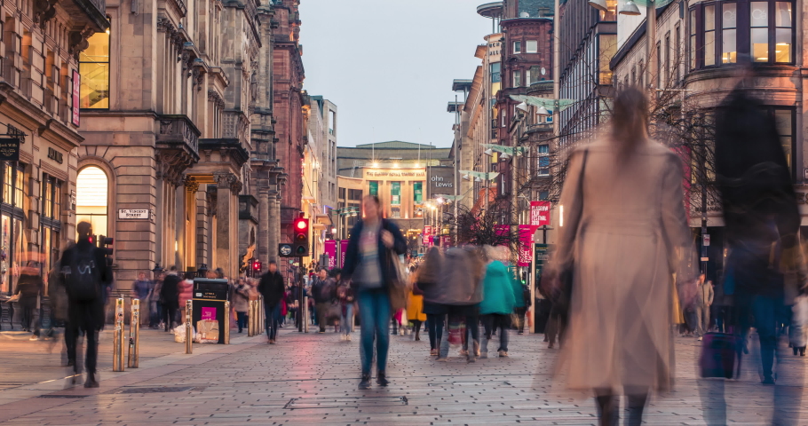 Glasgow, Scotland - February 15, 2019: time-lapse of shoppers and commuters during the evening rush hour on Buchanan street in the city centre