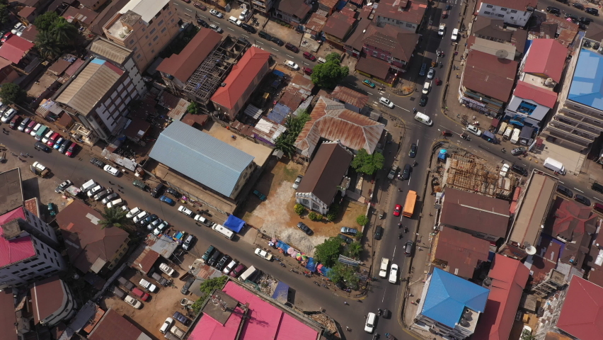 Aerial downtown Freetown Sierra Leone Africa. Sierra Leone on the coast of west Africa is a nation that suffers with extreme poverty and hunger. Congested crowded streets and businesses. Tropical.
