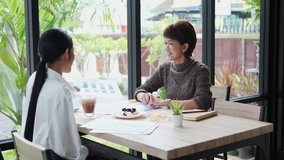 Customer asian woman paying for coffee and cake using credit card, contactless payment with waiter male at restaurant after coronavirus quarantine pandemic. - Powered by Shutterstock - Get 15% off with code: PIKWIZARD15