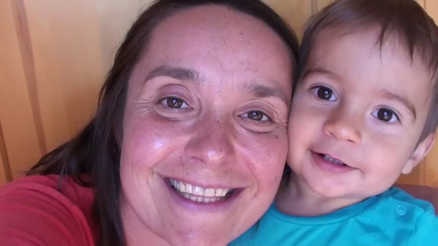 Funny mother makes selfie with her son who is not so interested
 | Shutterstock HD Video #10697102