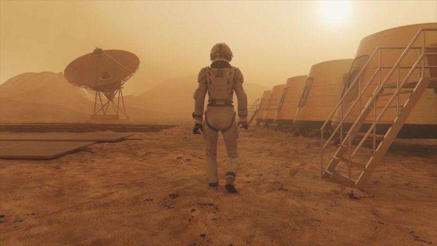 Astronaut on the planet Mars, making a detour around his base. Astronaut walking along the base. Small dust storm. The satellite dish sends data to the ground. Realistic 3D animation | Shutterstock HD Video #1069721092