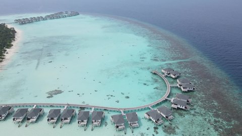 An Aerial video in Maldives of Overwater Villas in a luxury five star hotel 