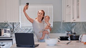 Happy mother and baby having video chat using smartphone mom holding toddler enjoying mobile technology sharing motherhood lifestyle.