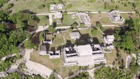 Drone video of the ancient historic Mayan city. Pyramids and temples of the ancient people by the sea at the site of archaeological excavations. Aerial view Tulum Mexico.